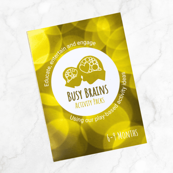 Busy Brains Activity Packs 6-9 Months play-based activity ideas. Yellow in colour. Central image shows the profile silhouette of a parent and child, foreheads touching, their brains depicted as a group of circles and hearts. Pack of cards A6 in size.
